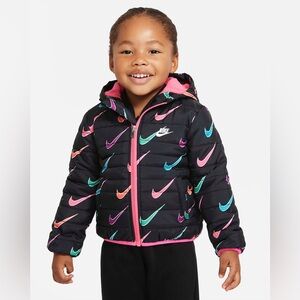 Size 12 months girls Nike Baby Puffer Jacket with hood. Black and multi colored.